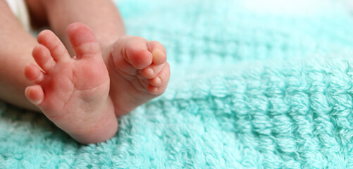 infant, Newborn baby's feet on blanket closeup