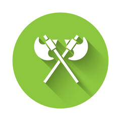 White Crossed medieval axes icon isolated with long shadow. Battle axe, executioner axe. Medieval weapon. Green circle button. Vector.
