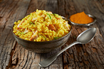Bowl of couscous and quinoa colored with saffron