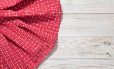 red table cloth on white wooden table