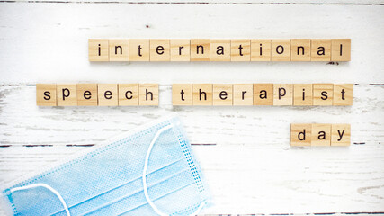 International day of speech therapy.words from wooden cubes with letters photo
