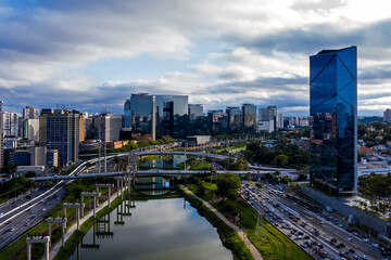 Fototapeta na wymiar View of Marginal Pinheiros with the Pinheiros river and modern buildings in Sao Paulo, Brazil