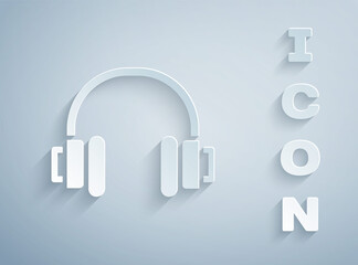 Paper cut Headphones icon isolated on grey background. Earphones. Concept for listening to music, service, communication and operator. Paper art style. Vector.