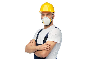 profession, construction and building - male worker or builder in yellow helmet and respirator with crossed arms over white background
