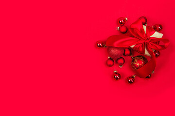 Christmas and new year banner gifts and new year toys on a red background