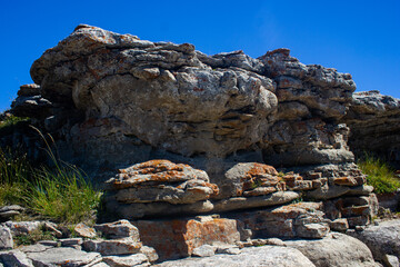 Scattering of stones in the mountains on the background of the blue sky