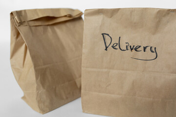 Craft bags with food delivery on a white background