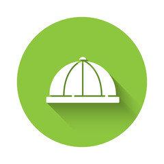 White Baby hat icon isolated with long shadow. Green circle button. Vector.