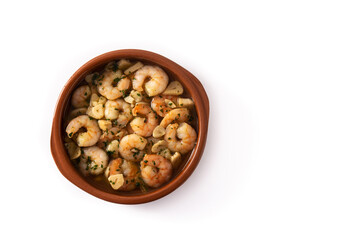 Garlic prawns in crock pot isolated on white background	. Top view. Copy space