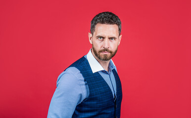 Bearded man with unshaven face and stylish haircut red background, hair