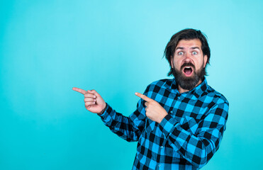 look over there. mature guy with moustache on face. expressing human emotions. pointing finger....