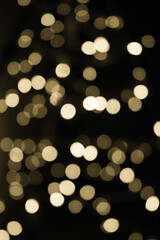 Abstract gold bokeh texture on black background