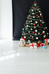 Christmas black interior Christmas tree holiday decor presents new year