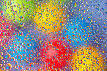 abstract colored balls of oily liquid on a blurred background