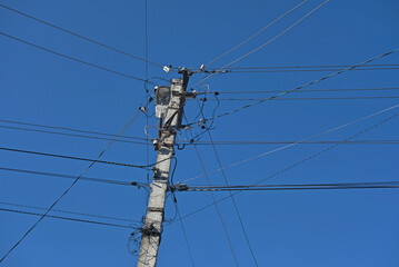power line pole against blue sky