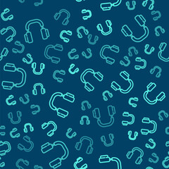 Green line Headphones icon isolated seamless pattern on blue background. Earphones. Concept for listening to music, service, communication and operator. Vector.
