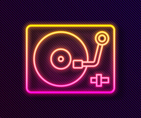 Glowing neon line Vinyl player with a vinyl disk icon isolated on black background. Vector.