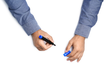 Man with marker on white background, top view. Closeup of hands