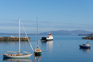 A ferry boat leaving the harbour of Mallaig in the Scottish highlands