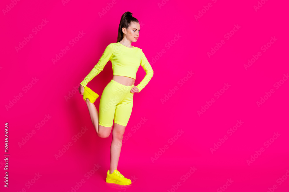 Sticker Full size profile side photo of serious sport girl stretch leg look empty space isolated over pink shine color background