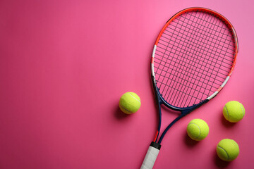 Tennis racket and balls on pink background, flat lay. Space for text