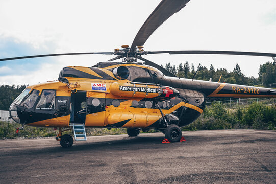 Sortavala, Karelia, Russia, August 15, 2020. Russian air force multirole helicopter Mil Mi-8. American Medical Clinic military medium twin-turbine helicopter in black and yellow orange