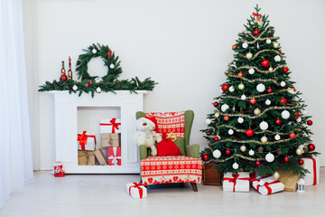Christmas tree with fireplace presents the decor of the house New Year