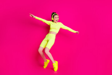 Fototapeta na wymiar Full length body size view of her she nice attractive fit slim sporty funky cheery girl listening music dancing having fun fooling isolated bright vivid shine vibrant pink fuchsia color background