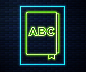 Fototapeta na wymiar Glowing neon line ABC book icon isolated on brick wall background. Dictionary book sign. Alphabet book icon. Vector.
