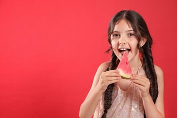 Cute little girl with watermelon on red background. Space for text