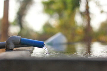 Water drop from plastic cock