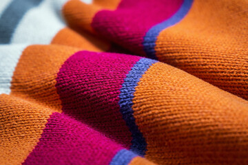 large knitting of woolen sweater loops of different colors. background