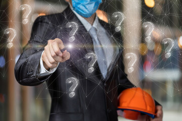 A civil engineer clicks on a question mark on a web background.