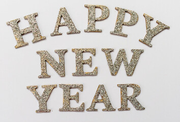 Naklejka premium Inscription Happy New Year in silver letters on a white background.