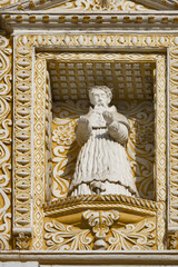 Obraz premium Ornate saint figures on the facade of the church La Merced in Antigua, Guatemala, Central America