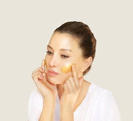 Concept of rejuvenation.Volume lifting.Applying the cream