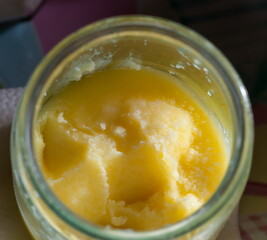 Melted butter in a glass jar.