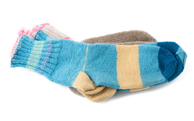 pair of striped handmade knitted warm socks made of sheep’s wool yarn