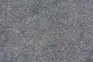 Texture of dry asphalt of gray color.