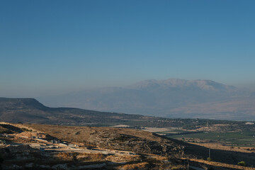 Naftali mountains range with keren naftali mountain, Hula valley, Golan Heights and Mount Hermon as seen from Kibbutz Malkia lookout point, located on iraeli-lebanese border in Upper Galilee, Israel.