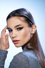 Fototapeta premium Beautiful brunette bright makeup close-up attractive look