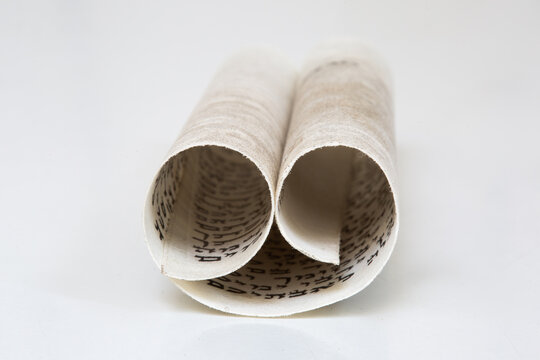 A Mezuzah scroll called a Klaf inscribed with Hebrew verses from the Torah. These verses consist of the Jewish prayer Shema Yisrael.