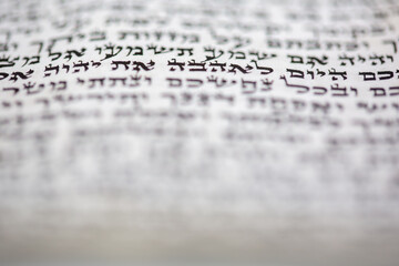 A Mezuzah scroll called a Klaf inscribed with Hebrew verses from the Torah. These verses consist of...