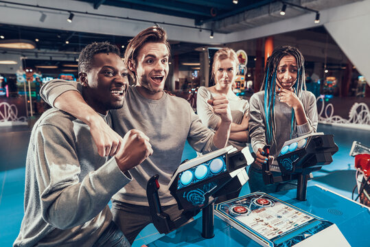 Guys are happy because they won a video game.