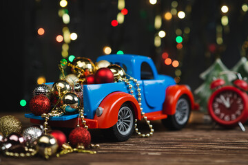 New year or Christmas composition with Christmas balls and a car toy