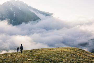 Group tourist with backpack hiking in mountains Travel Lifestyle