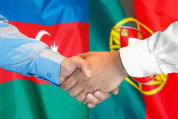 Business handshake on the background of two flags. Men handshake on the background of the Azerbaijan and Portugal flag. Support concept