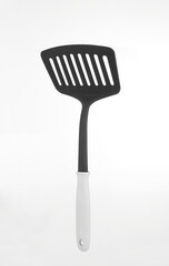 Plastic black kitchenware utensil isolated on white background.