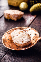 slice of fried bread with cinnamon and sugar in old copper skimmer. Dessert called 