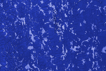 Fototapeta na wymiar A background of old, cracked blue paint.